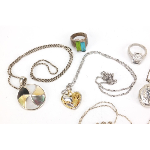 651 - Silver jewellery comprising two lockets on chains, four pendants on chains and two rings, total 68.0... 