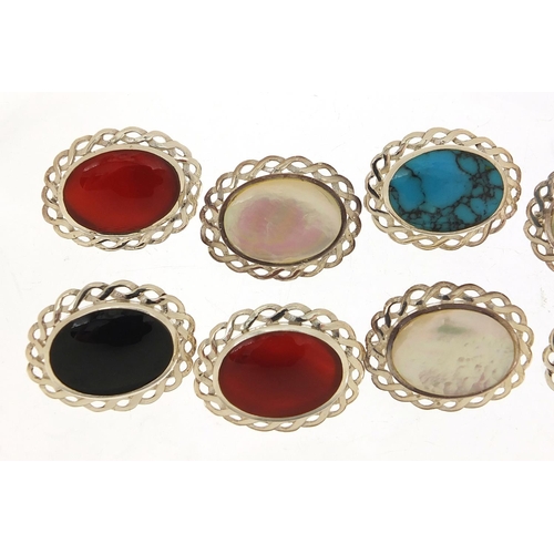 884 - Ten silver cabochon stone brooches including mother of pearl, turquoise and carnelian, 2.6cm wide, 5... 