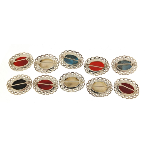 884 - Ten silver cabochon stone brooches including mother of pearl, turquoise and carnelian, 2.6cm wide, 5... 