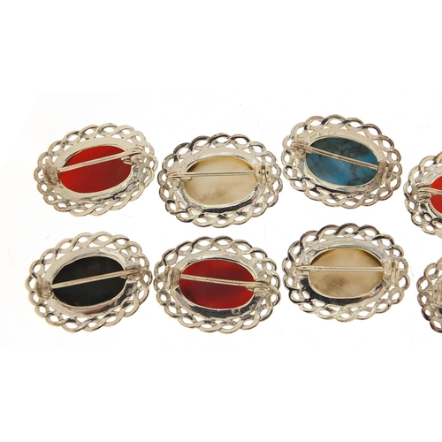 884 - Ten silver cabochon stone brooches including mother of pearl, turquoise and carnelian, 2.6cm wide, 5... 