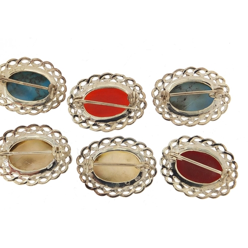 884 - Ten silver cabochon stone brooches including mother of pearl, turquoise and carnelian, 2.6cm wide, 5... 