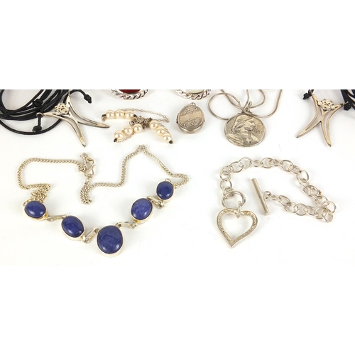 619 - Silver jewellery including four cabochon stone brooches, lapis lazuli necklace, locket, two monkey p... 