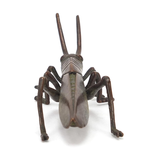 475 - Japanese patinated bronze locust, impressed marks to the base, 11cm in length