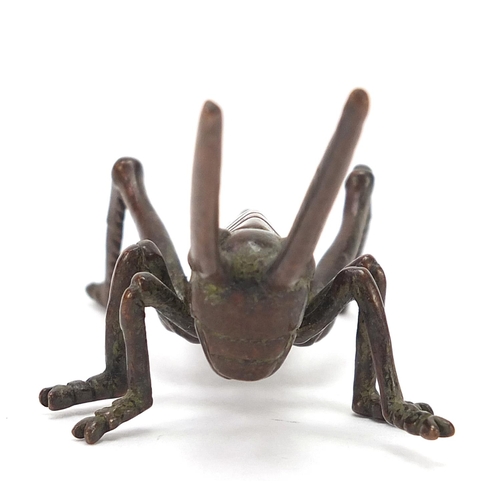 475 - Japanese patinated bronze locust, impressed marks to the base, 11cm in length