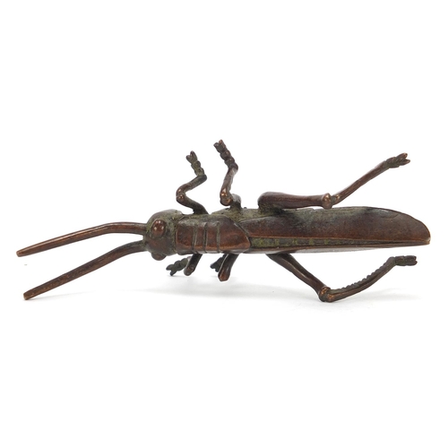 475 - Japanese patinated bronze locust, impressed marks to the base, 11cm in length