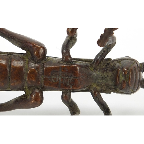 475 - Japanese patinated bronze locust, impressed marks to the base, 11cm in length