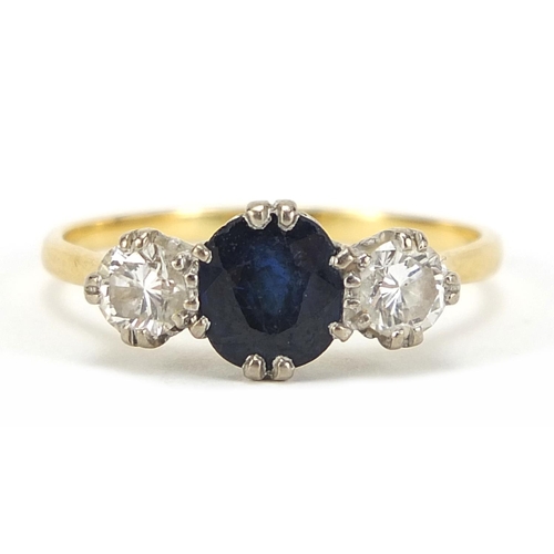 13 - Unmarked gold, sapphire and diamond three stone ring, the sapphire approximately 7mm x 6mm, the diam... 