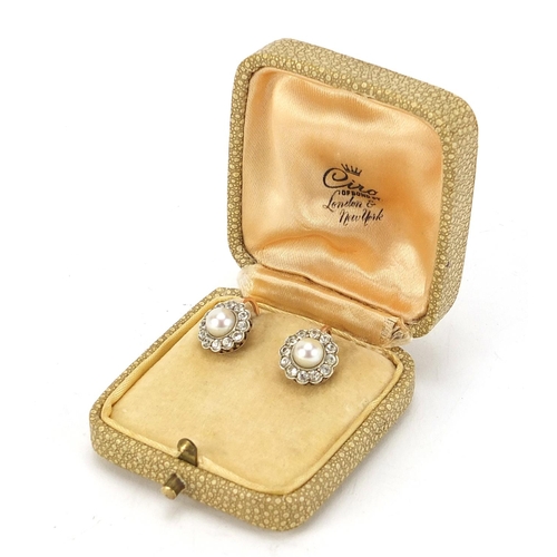 1069 - Pair of 9ct gold Ciro pearl and clear stone earrings with screw backs, 1.1cm in diameter, 3.2g