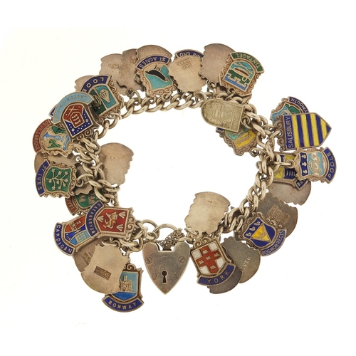 582 - Silver and enamel souvenir shield charm bracelet, 69.0g