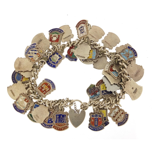 547 - Silver and enamel souvenir shield charm bracelet, 74.5g