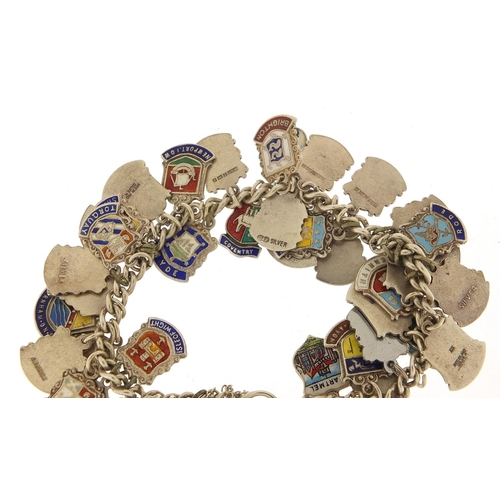 547 - Silver and enamel souvenir shield charm bracelet, 74.5g