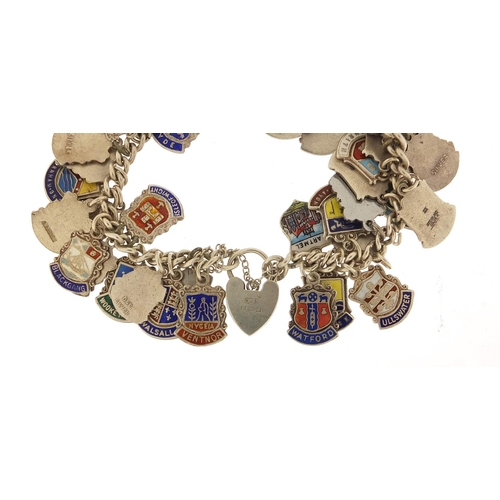 547 - Silver and enamel souvenir shield charm bracelet, 74.5g