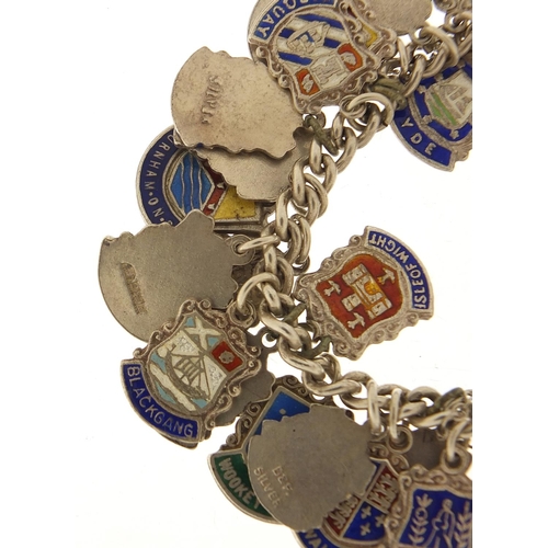 547 - Silver and enamel souvenir shield charm bracelet, 74.5g