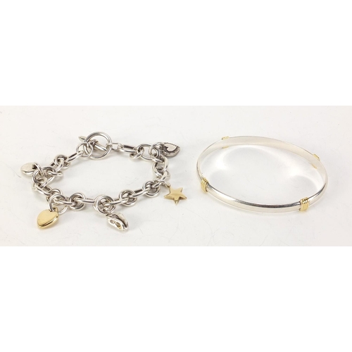 343 - Modern silver charm bracelet with 9ct gold and silver charms and a silver bangle, 74.5g