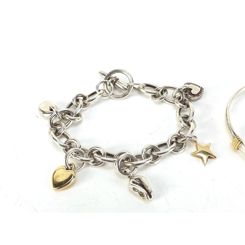 343 - Modern silver charm bracelet with 9ct gold and silver charms and a silver bangle, 74.5g