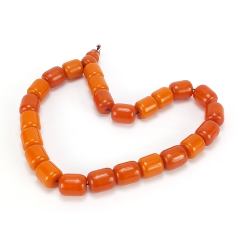 667 - Amber coloured bead necklace, 48cm in length, 146.2g