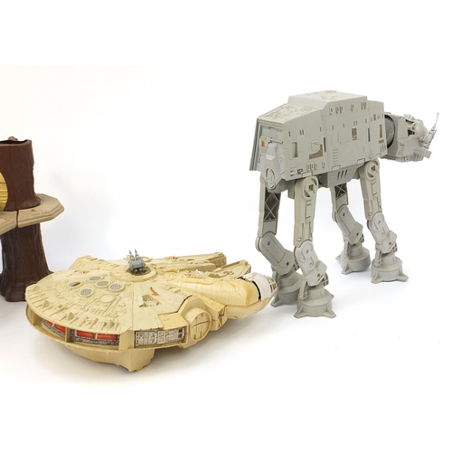 2428 - Vintage Star Wars toys comprising AT AT, Ewok village and Millennium Falcon