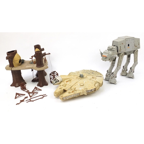 2428 - Vintage Star Wars toys comprising AT AT, Ewok village and Millennium Falcon