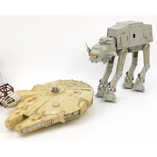 2428 - Vintage Star Wars toys comprising AT AT, Ewok village and Millennium Falcon