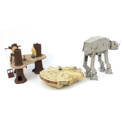 2428 - Vintage Star Wars toys comprising AT AT, Ewok village and Millennium Falcon