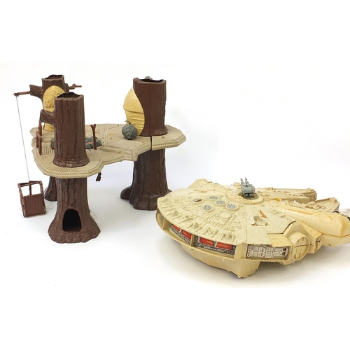 2428 - Vintage Star Wars toys comprising AT AT, Ewok village and Millennium Falcon