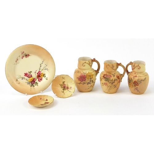 75 - Royal Worcester blush ivory comprising three jugs, pair of dishes and a side plate, each decorated w... 