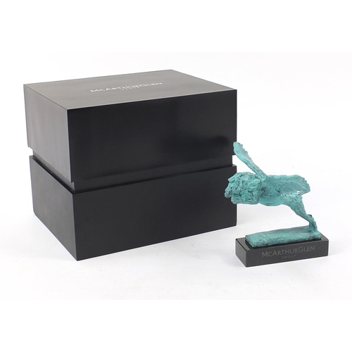 1079 - McArthur Glen Group, Verdigris bronze study of winged lion raised on a rectangular slate base with b... 