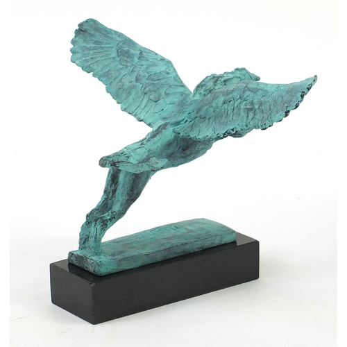 1079 - McArthur Glen Group, Verdigris bronze study of winged lion raised on a rectangular slate base with b... 