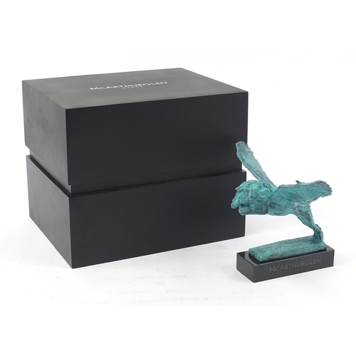 1080 - McArthur Glen Group, Verdigris bronze study of winged lion raised on a rectangular slate base with b... 