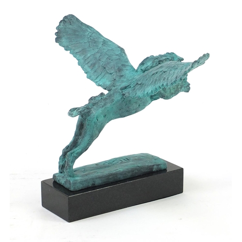 1080 - McArthur Glen Group, Verdigris bronze study of winged lion raised on a rectangular slate base with b... 