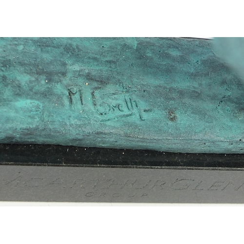 1080 - McArthur Glen Group, Verdigris bronze study of winged lion raised on a rectangular slate base with b... 