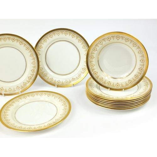 899 - Fourteen Aynsley Gold Dowery 10.5 inch dinner plates and two 9.5 inch soup bowls