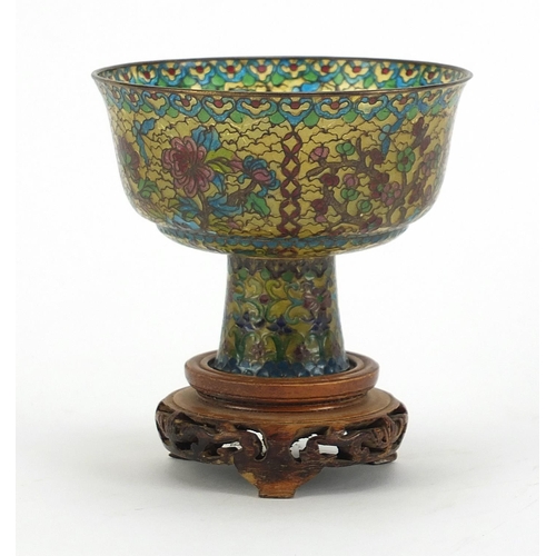 930 - Chinese plique à jour enamel stem cup on carved hardwood stand, overall 10.5cm high