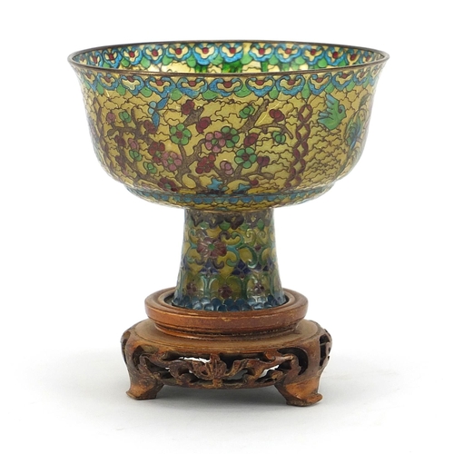 930 - Chinese plique à jour enamel stem cup on carved hardwood stand, overall 10.5cm high