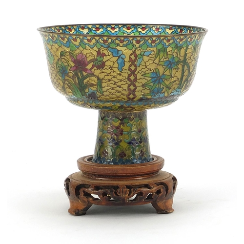 930 - Chinese plique à jour enamel stem cup on carved hardwood stand, overall 10.5cm high