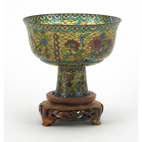 930 - Chinese plique à jour enamel stem cup on carved hardwood stand, overall 10.5cm high