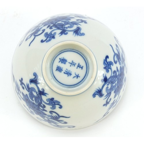 711 - Chinese blue and white porcelain bowl hand painted with flowers, six figure character marks to the b... 