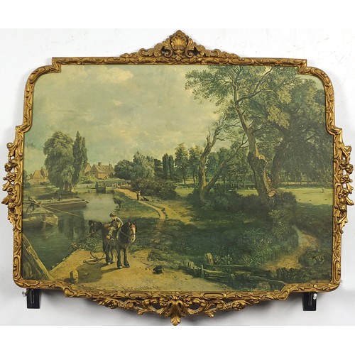 450A - After Constable - Young boy on horse beside river, print in colour housed in an ornate gilt metal fr... 