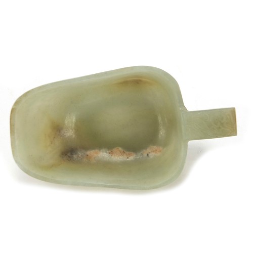 112 - Chinese celadon jade libation cup carved with water dragons, 10.5cm in length