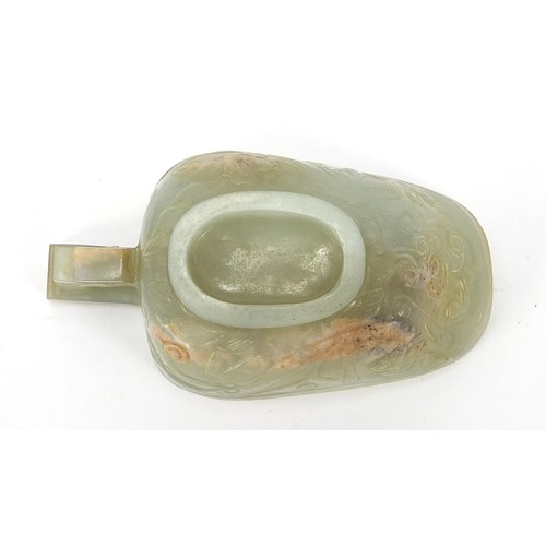 112 - Chinese celadon jade libation cup carved with water dragons, 10.5cm in length