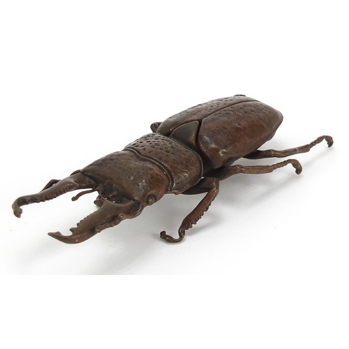 292 - Large Japanese patinated bronze beetle with articulated back, impressed marks to the underside, 13.5... 