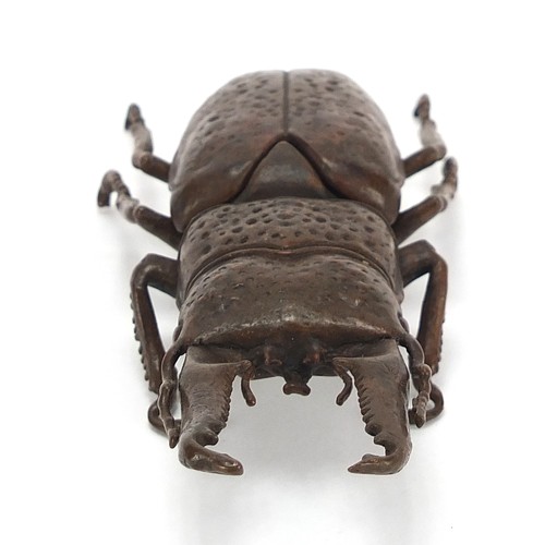 292 - Large Japanese patinated bronze beetle with articulated back, impressed marks to the underside, 13.5... 