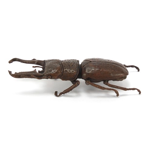 292 - Large Japanese patinated bronze beetle with articulated back, impressed marks to the underside, 13.5... 