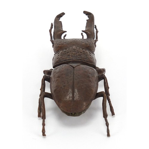 292 - Large Japanese patinated bronze beetle with articulated back, impressed marks to the underside, 13.5... 