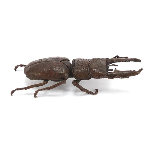 292 - Large Japanese patinated bronze beetle with articulated back, impressed marks to the underside, 13.5... 