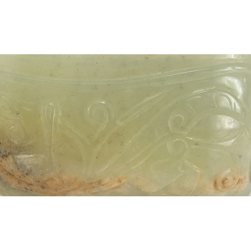 112 - Chinese celadon jade libation cup carved with water dragons, 10.5cm in length