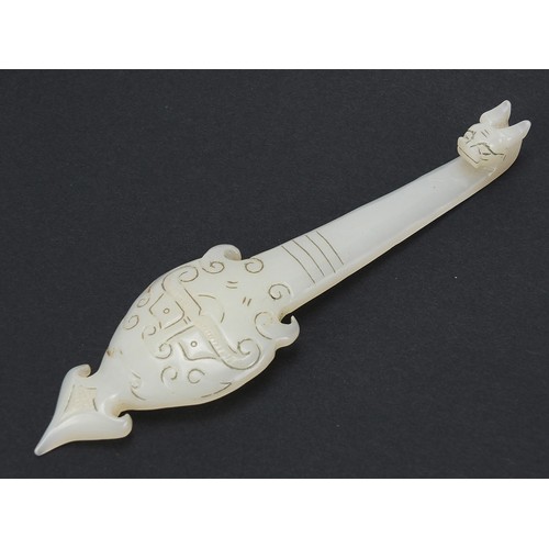 565 - Chinese carved white jade belt hook, 16cm in length