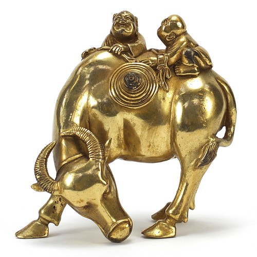 291 - Chinese gilt bronze figure of two boys on a water buffalo, 14cm high