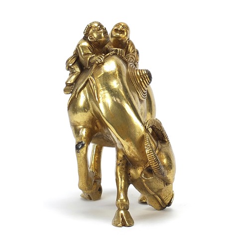 291 - Chinese gilt bronze figure of two boys on a water buffalo, 14cm high