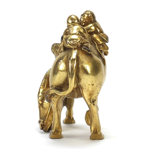 291 - Chinese gilt bronze figure of two boys on a water buffalo, 14cm high